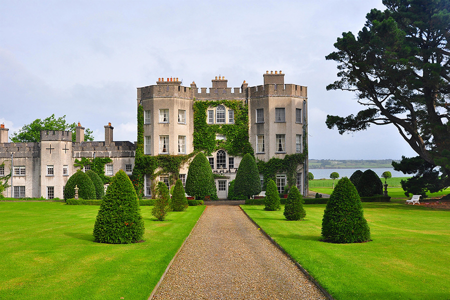 Ivy-covered manor house with formal gardens